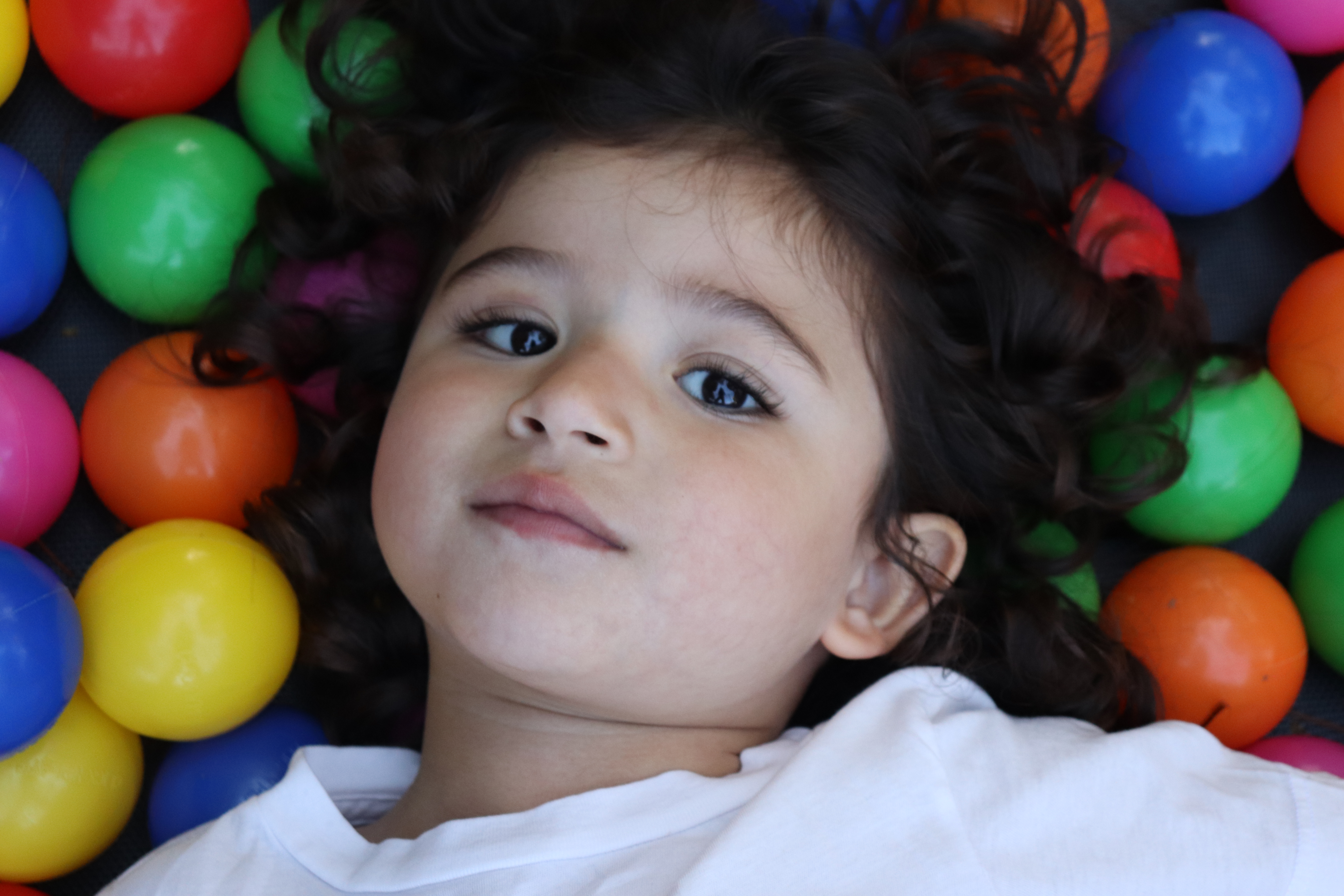 Max as a toddler in a colorful ball pit