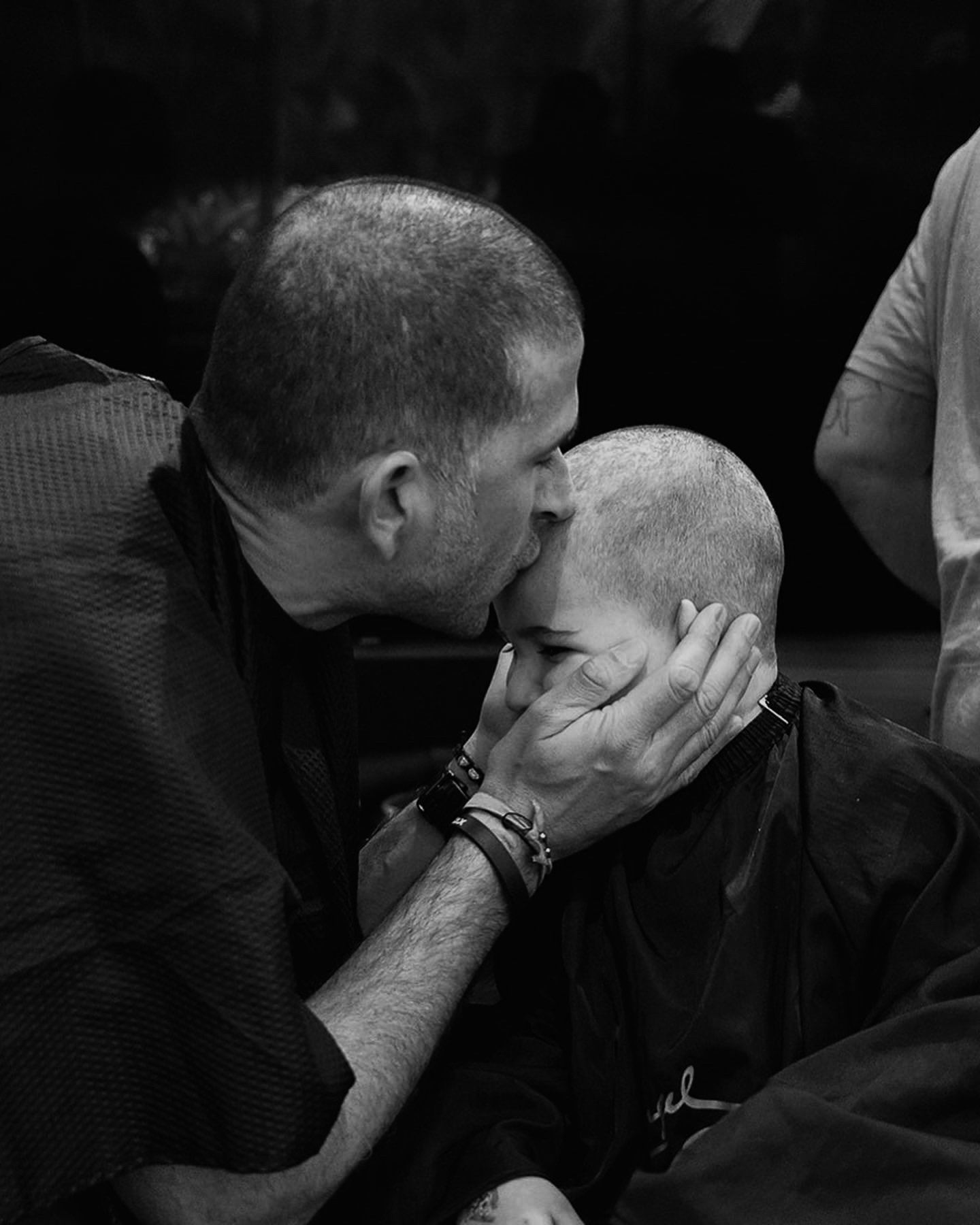Father kissing Max's head during treatment
